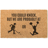 a door mat with a picture of two people on skis
