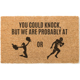 a door mat with a picture of a woman running and a man holding a cheer