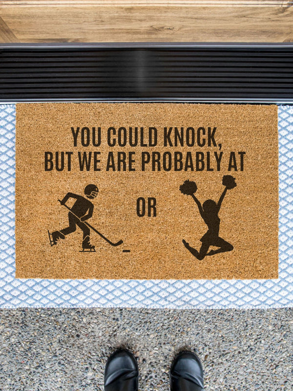 a door mat that says you could knock, but we are probably at or