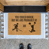 a door mat that says you could knock, but we are probably at or