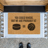 a door mat that says you could knock, but we are probably at or