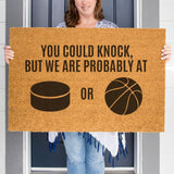 a woman holding a sign that says you could knock, but we are probably at