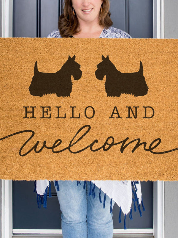 2 Scottish Terriers on a Doormat